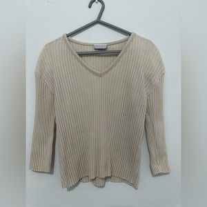 Tan long sleeve top with V- neck. Stretch material
